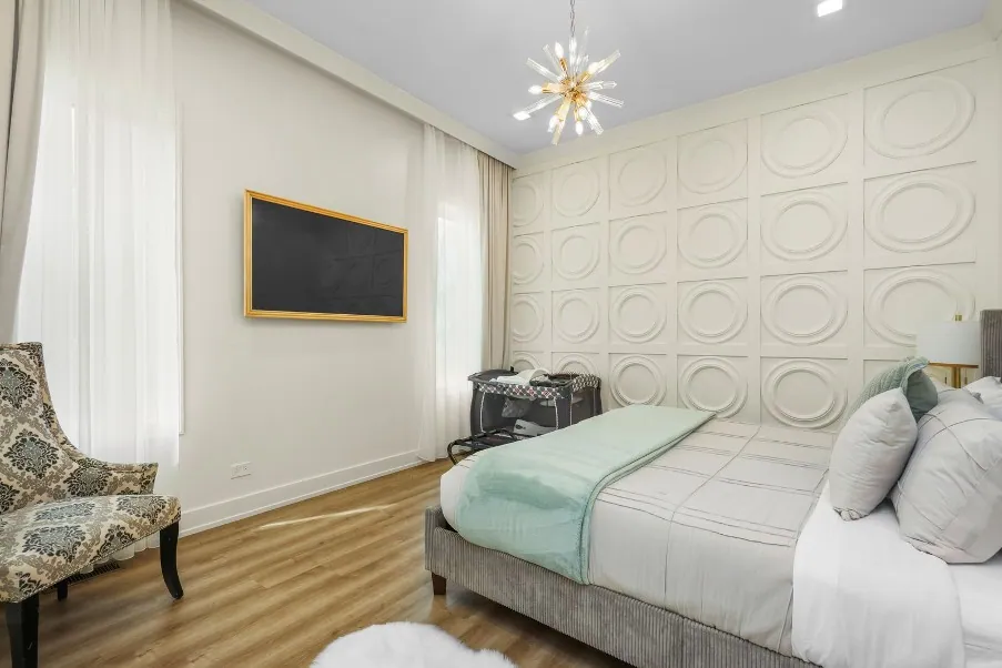 Bedroom with paneled wall