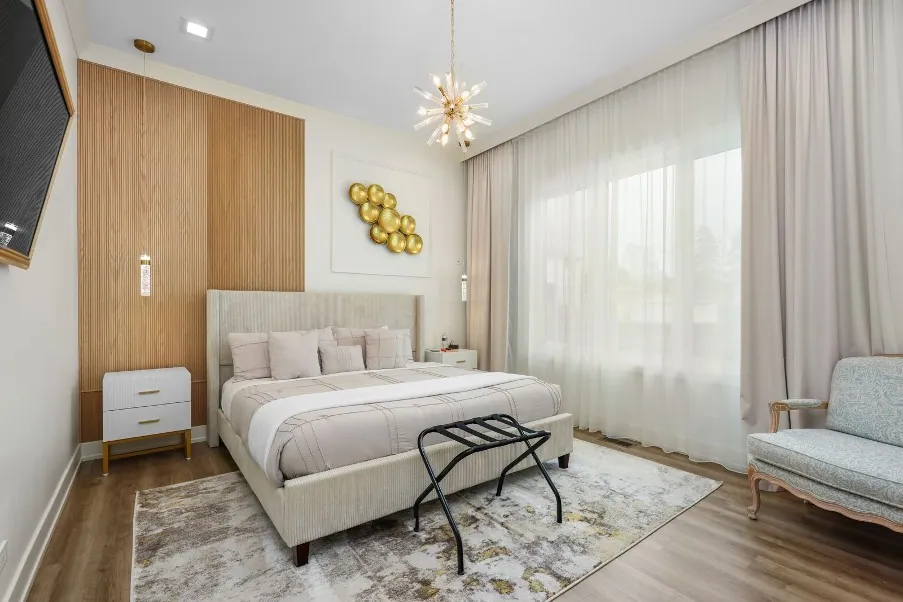 King bedroom with lounge chairs