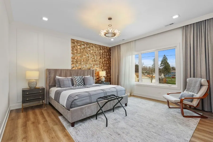 King bedroom with stone accent wall